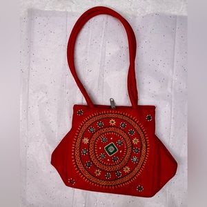 Unique red handmade mirror beaded bag.